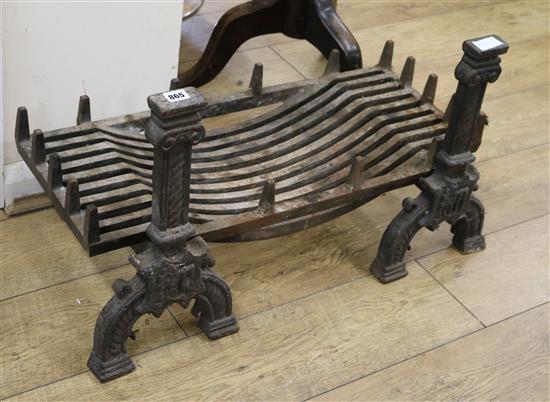 A pair of fire irons and a fire basket basket W.76cm